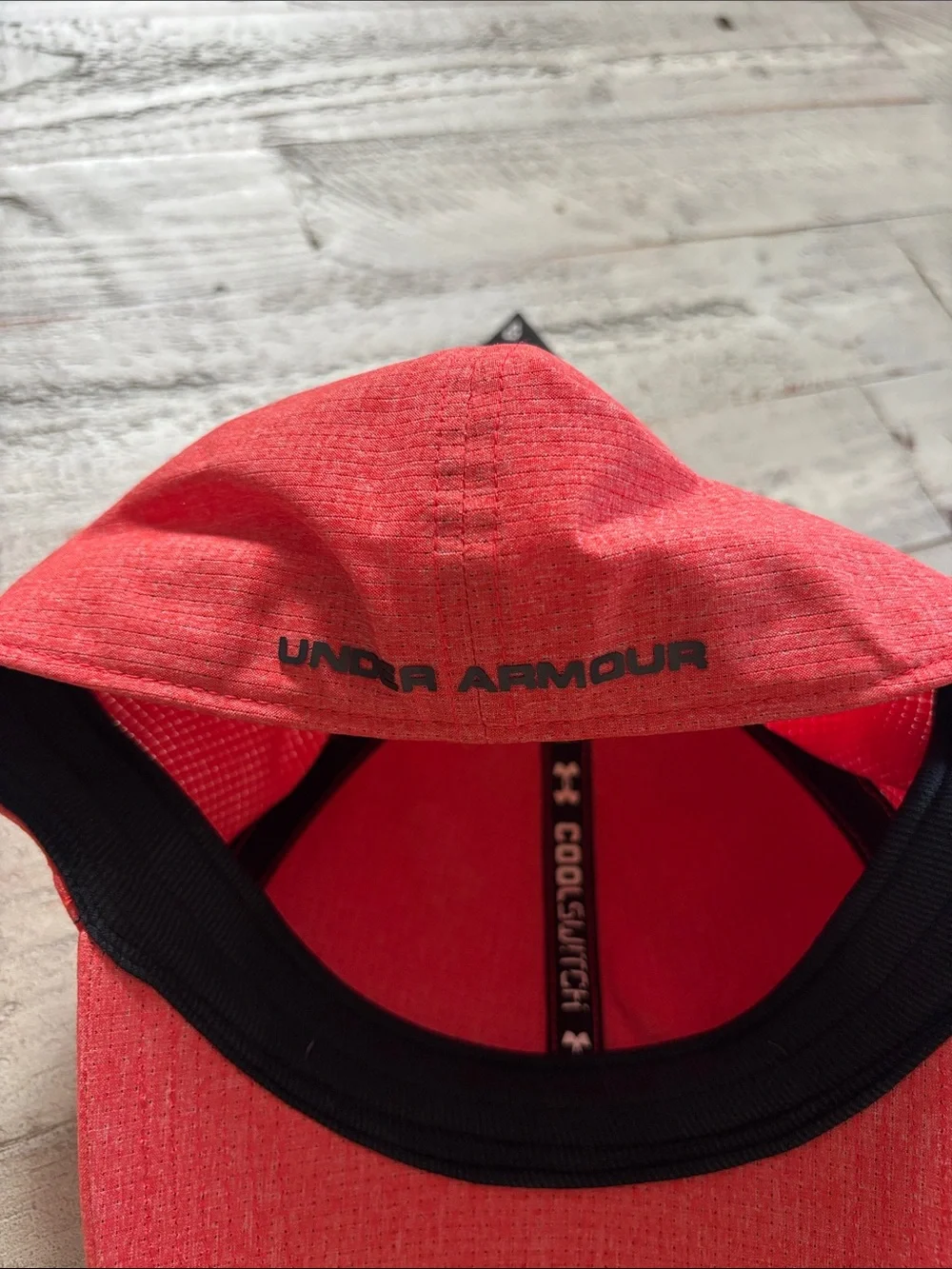 Men’s Under Armour Redish Orange Performance Hat with Black Logo